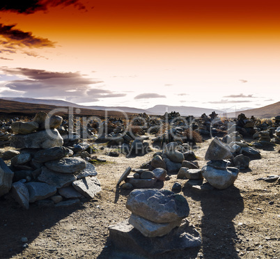 Horizontal vivid sunset Norway polar stones field landscape back