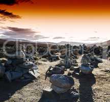 Horizontal vivid sunset Norway polar stones field landscape back
