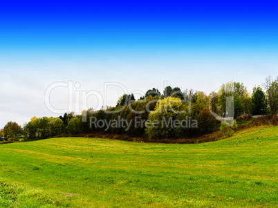 Horizontal danish field hills with blue sky background backdrop