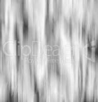 Vertical black and white falling snow in motion abstraction back