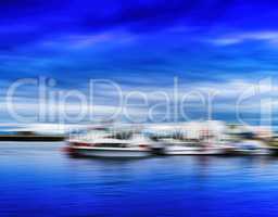 Horizontal blue vivid Norway ships at pier motion blur abstracti