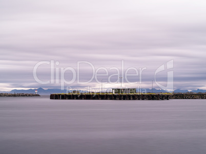 Horizontal dramatic Norway northern pier quay cloudscape backgro