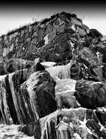 Vertical vibrant black and white frozen waterfall bokeh composit