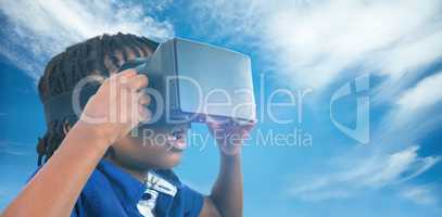 Composite image of profile view of little boy holding virtual gl