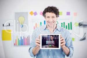 Composite image of businessman showing digital tablet with blank