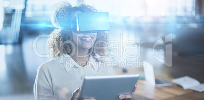 Woman wearing virtual reality glass with digital tablet