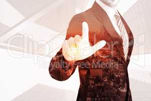 Composite image of businessman pointing with his finger