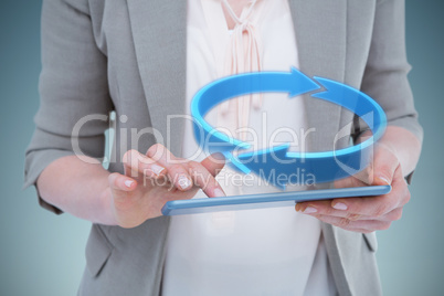 Composite image of close up of woman using tablet