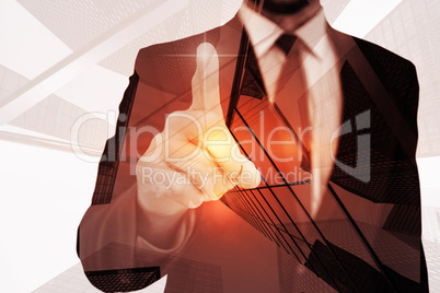 Composite image of businessman pointing his finger at camera