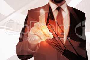 Composite image of businessman pointing his finger at camera