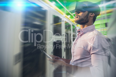 Composite image of side view of businessman holding virtual glas