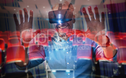 Composite image of businessman using an oculus
