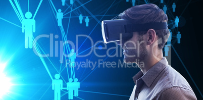 Composite image of profile view of businessman holding virtual g
