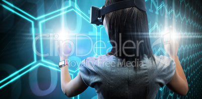 Composite image of woman using a virtual reality device