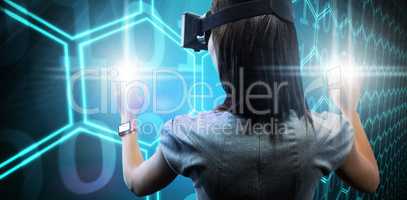 Composite image of woman using a virtual reality device