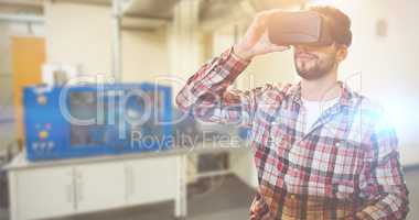 Composite image of casual man man holding virtual glasses on a w