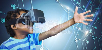 Composite image of side view of little boy holding virtual glass