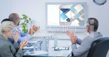 Composite image of business team applauding and looking at white