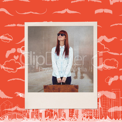 Composite image of smiling hipster woman holding suitcase