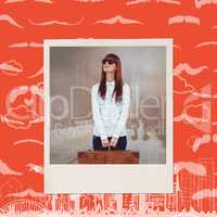 Composite image of smiling hipster woman holding suitcase