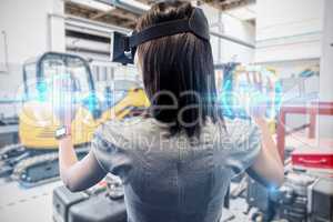 Composite image of woman using a virtual reality device