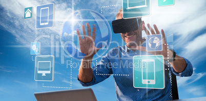 Composite image of businessman holding virtual glasses