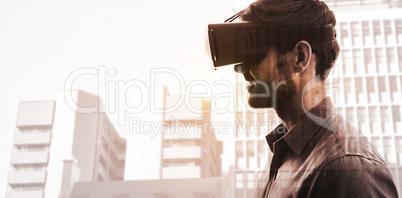 Composite image of profile view of businessman holding virtual g