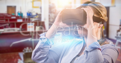 Composite image of woman using an oculus