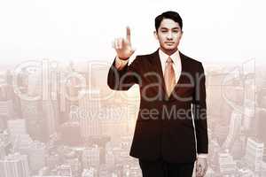 Composite image of stern asian businessman pointing