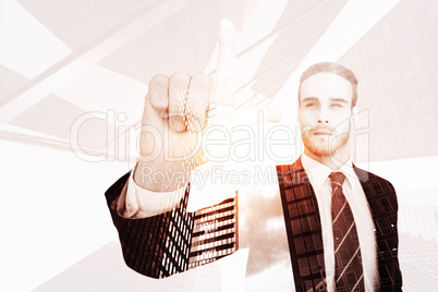 Composite image of unsmiling businessman in suit pointing up his