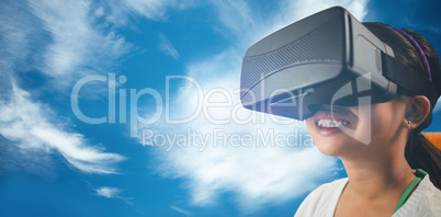 Composite image of close up of little girl holding virtual glass