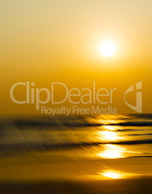 Vertical vivid orange sunset motion blur abstraction background