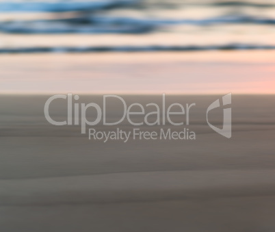 Horizontal pale smooth sand beach bokeh blur background backdrop