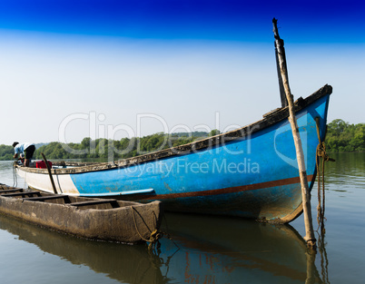 Indian fisherman in his boat background