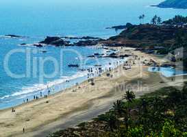 Horizontal vibrant indian beach with crowd of people background