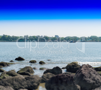 Horizontal dramatic indian stony beach bokeh landscape backgroun