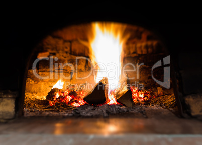 Horizontal vibrant fire in stove bokeh background backdrop