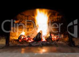 Horizontal vibrant fire in stove bokeh background backdrop