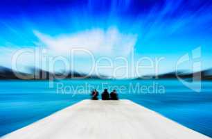 Horizontal vivid three freinds sitting on the quay motion blur a