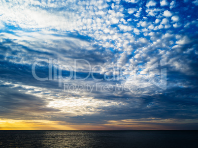 Horizontal vibrant ocean horizon cloudscape background backdrop