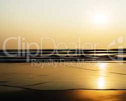 Horizontal vivid sunset ocean horizon tidal waves blur landscape