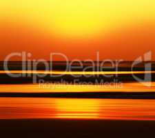 Horizontal vivid orange golden Indian ocean sunset motion abstra