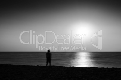 Horizontal vivid black and white meeting ocean sunset lonely man