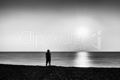 Horizontal vivid black and white meeting ocean sunset lonely man