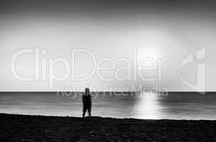 Horizontal vivid black and white meeting ocean sunset lonely man