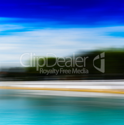 Horizontal vivid ocean beach landscape motion blur background ba