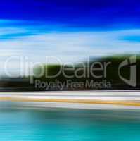 Horizontal vivid ocean beach landscape motion blur background ba