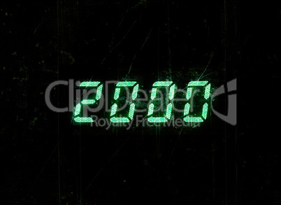 Horizontal green digital 2000 millenium display clock dust parti