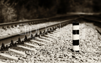 Horizontal sepia railroad milage column bokeh background