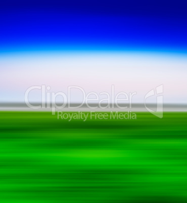 Square vivid green landscape with blue sky  motion blur abstract